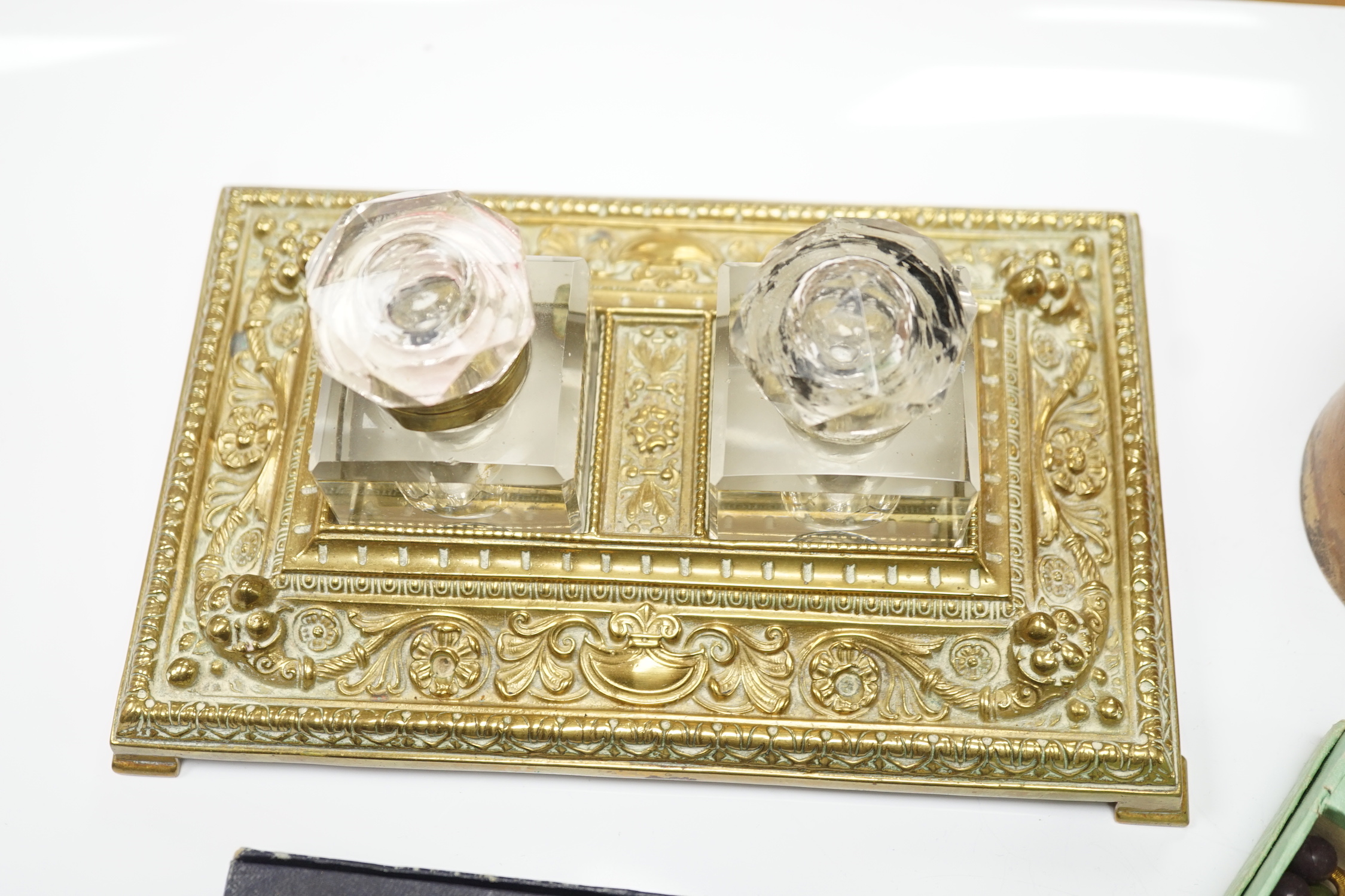 A brass inkwell, a treen box and a sealing wax set